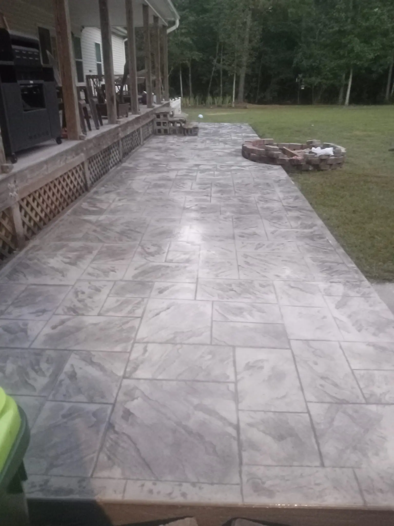 Finished stamped concrete patio with paver border